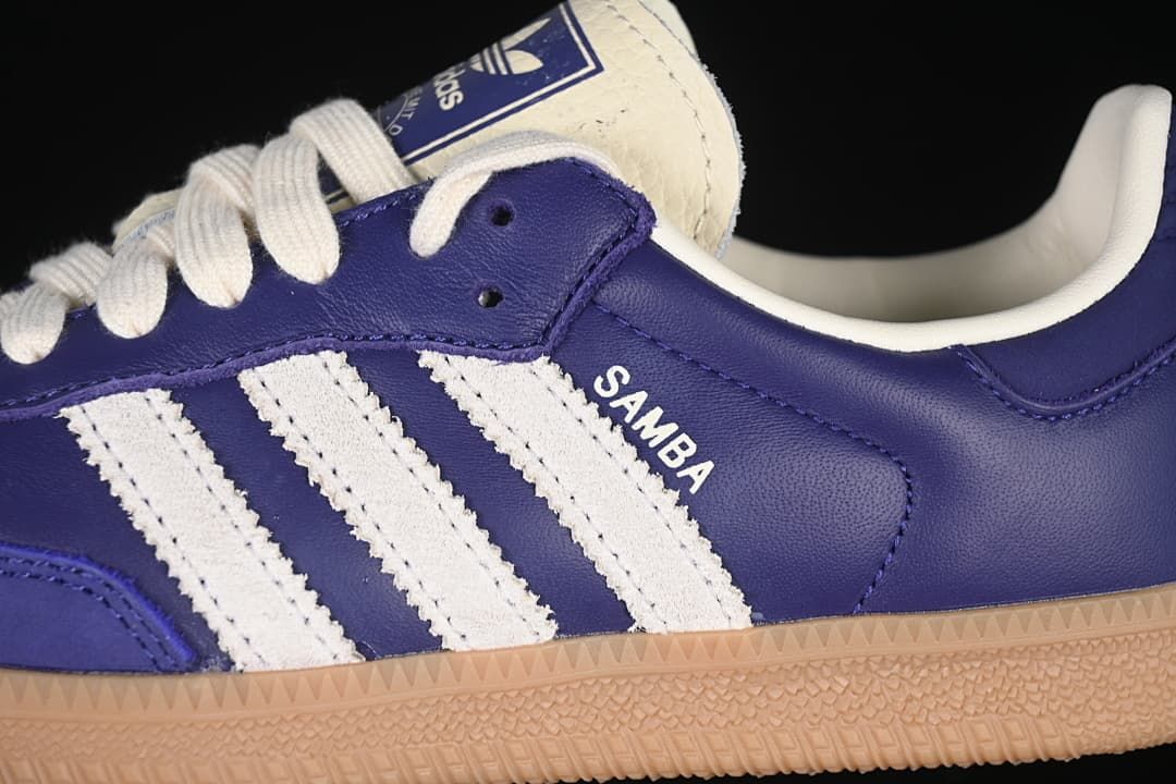 Close-up of the purple upper, white stripes and gum-colored sole