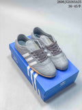 Gray adidas Originals Tokyo low-top sneakers with white side stripes and gum-colored soles