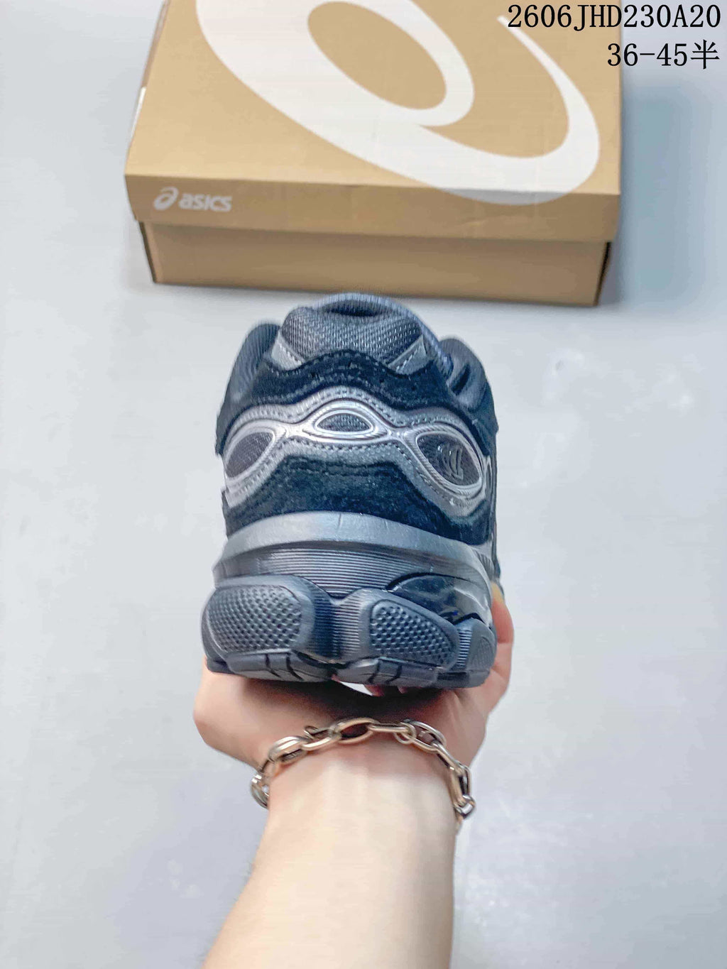 Rear view showing the heel and sculpted outsole of an ASICS sneaker