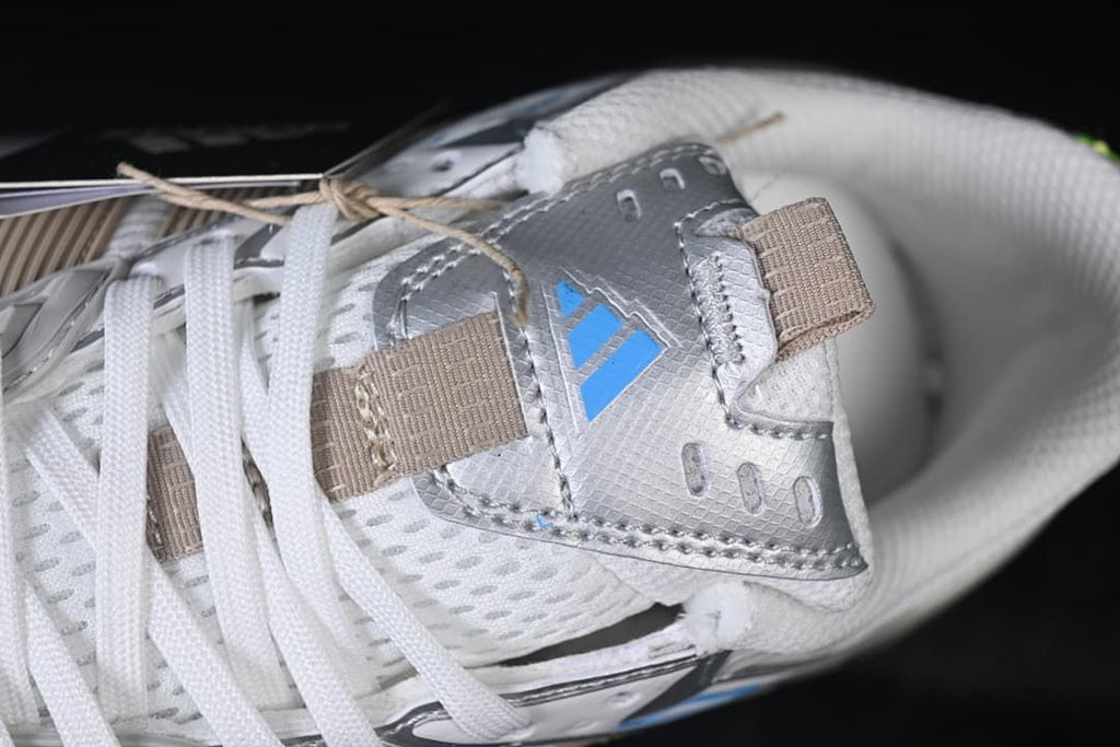 Close-up of the lace area, tongue, and blue adidas marking.