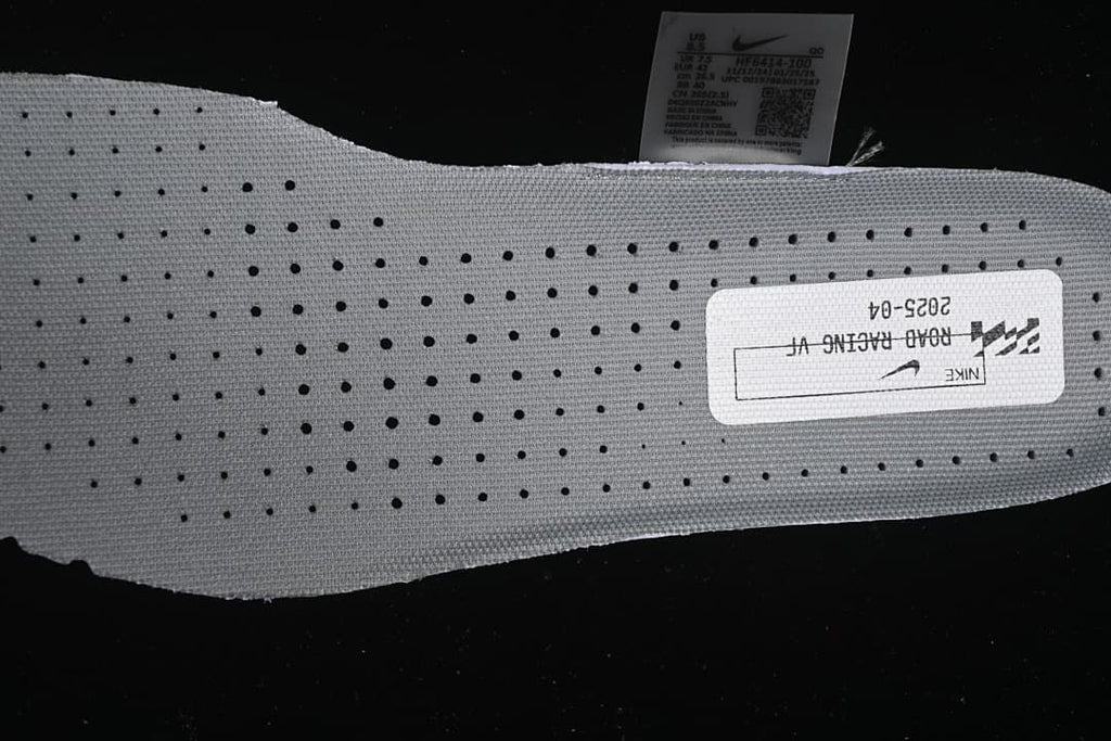 Close view of the perforated insole and printed road racing label.