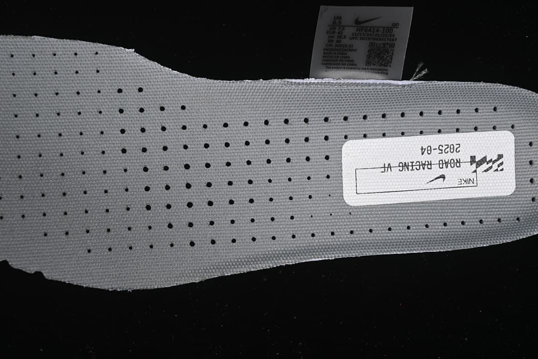 Close view of the perforated insole and printed road racing label.