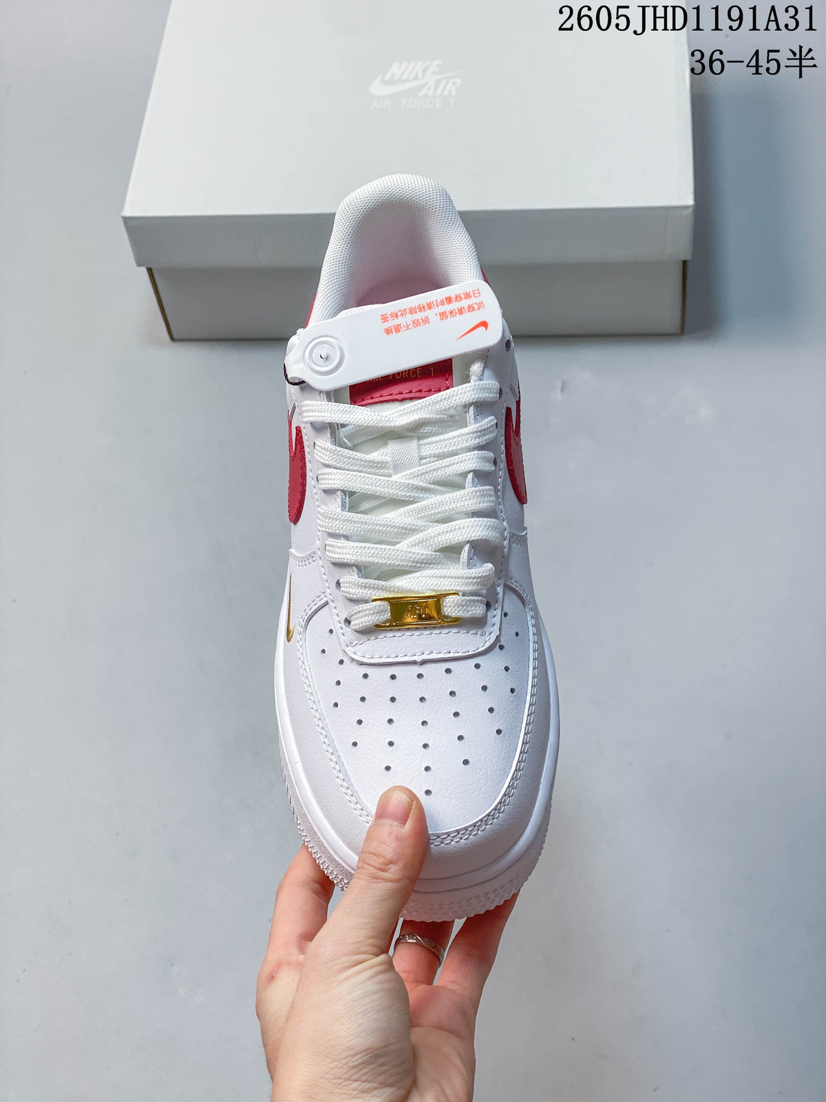 Front view showing the perforated toe, white laces, and gold-tone lace accent