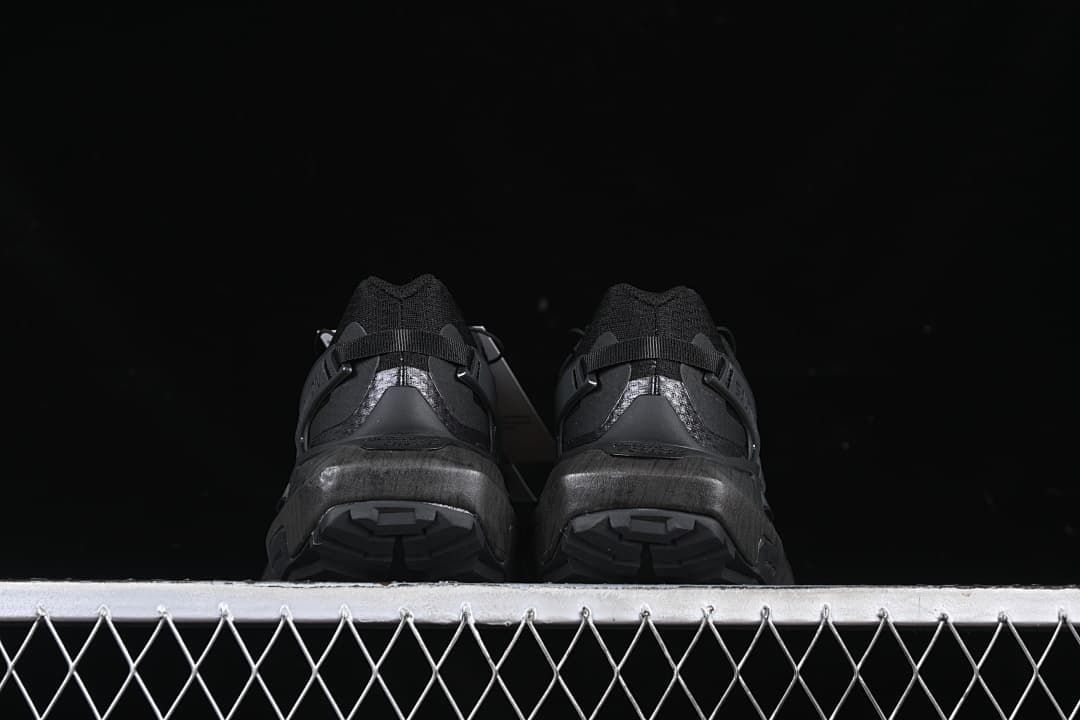 Rear view of both shoes showing heel details and outsole tread.