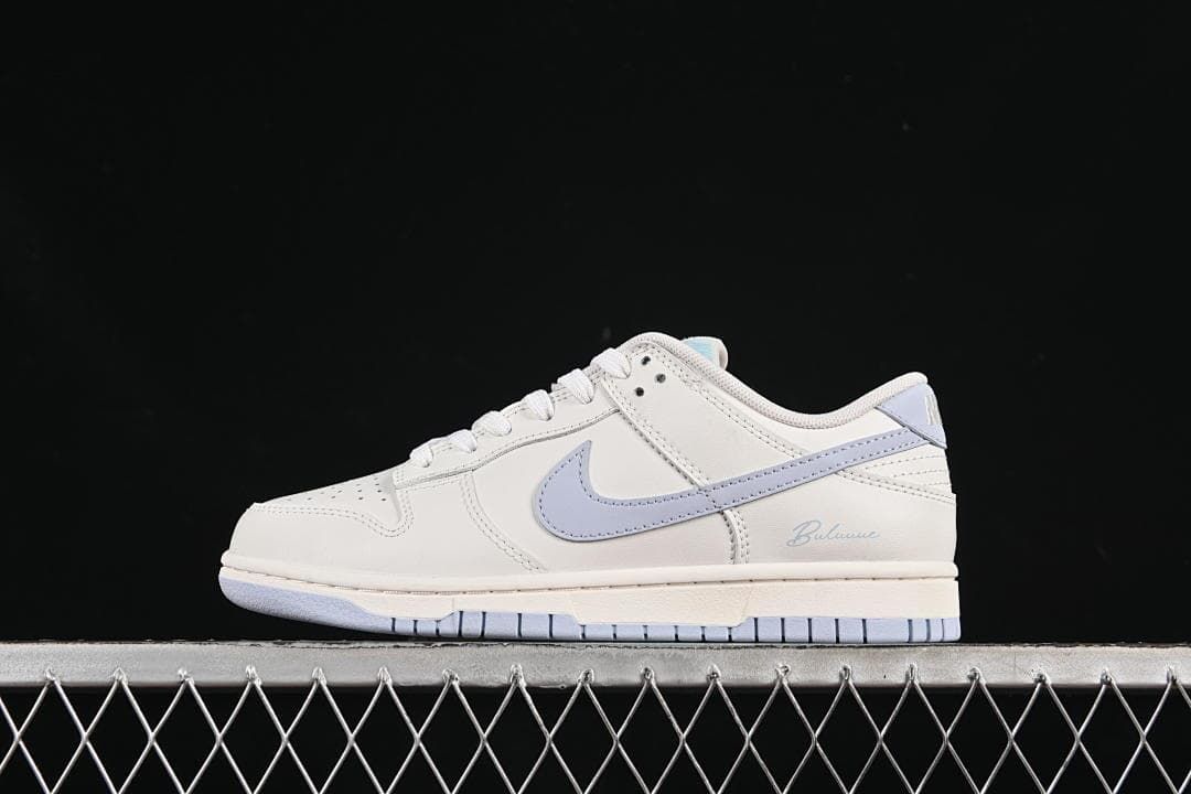 Side profile of the sneaker in white and light blue