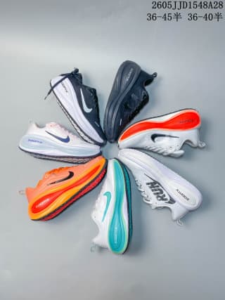 Several Nike Vomero Plus shoes arranged in a circle to show different color variations.