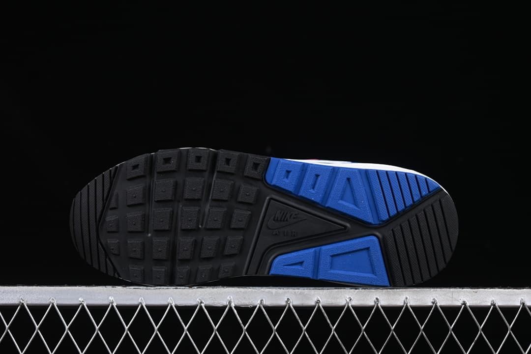 Underside view showing the black and blue patterned outsoles