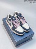 Pair of navy, white and pink Air Jordan 1 Low sneakers on a shoebox