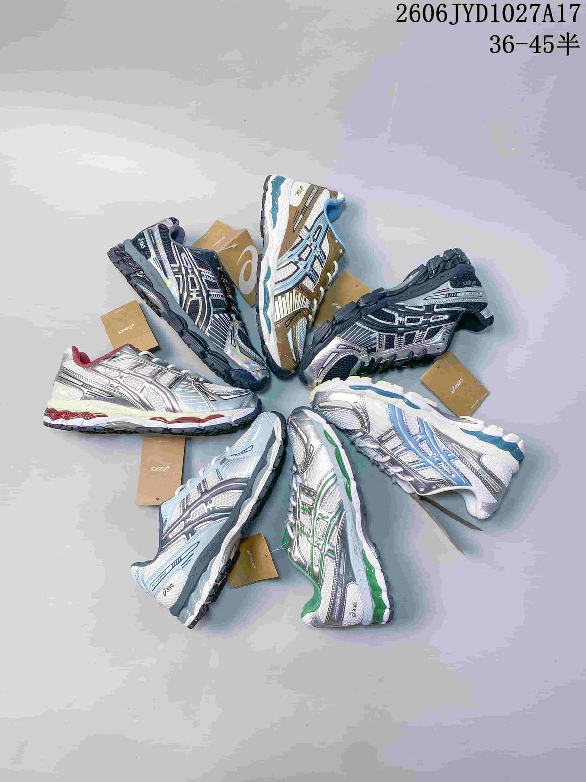 White and silver ASICS GEL-KAYANO 12.1 sneaker with brown and blue accents