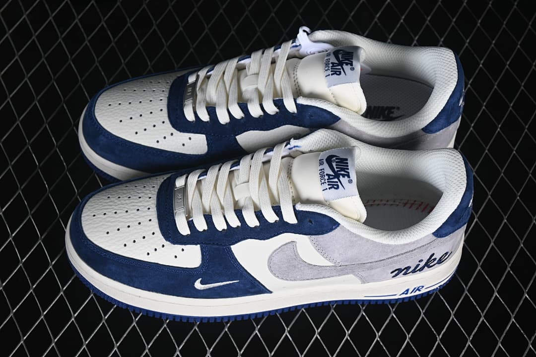 Pair of white, gray, and navy low-top sneakers shown from above.