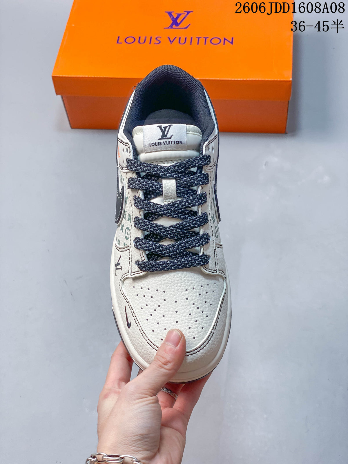 Top view of a cream sneaker showing its perforated toe box and dark laces
