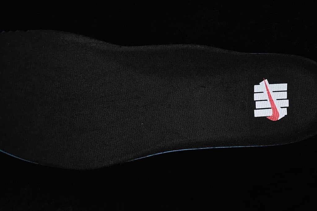 Black insole with a white-and-red logo graphic