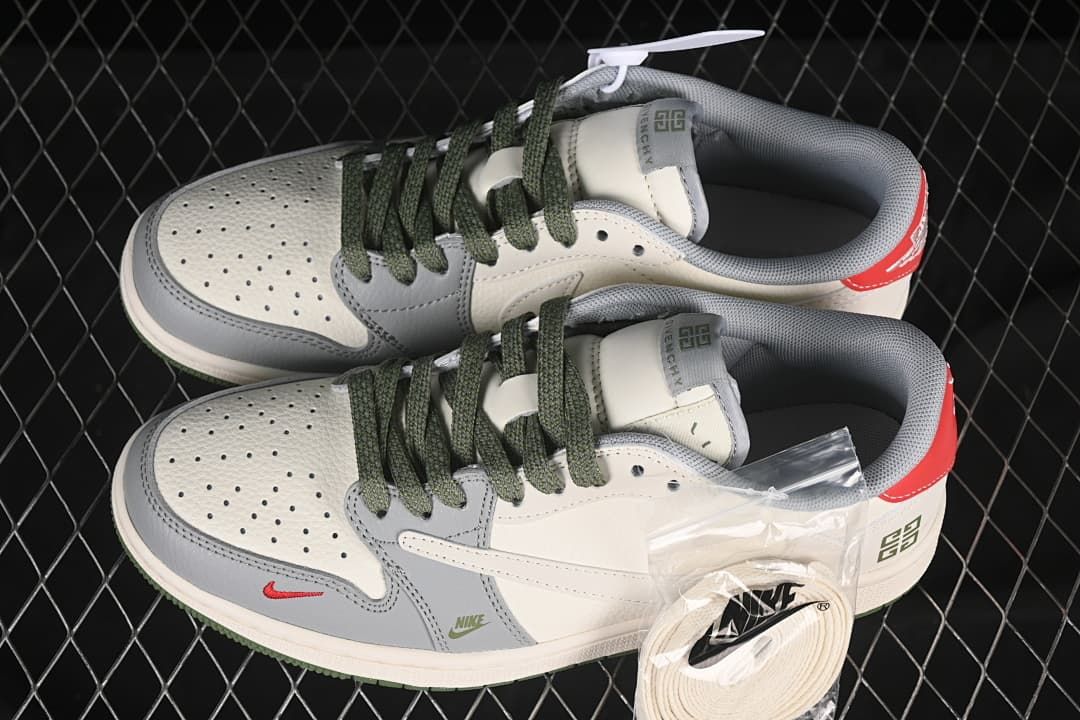 Pair of off-white and grey low-top sneakers with dark green laces, red heel accents, and an additional set of light laces