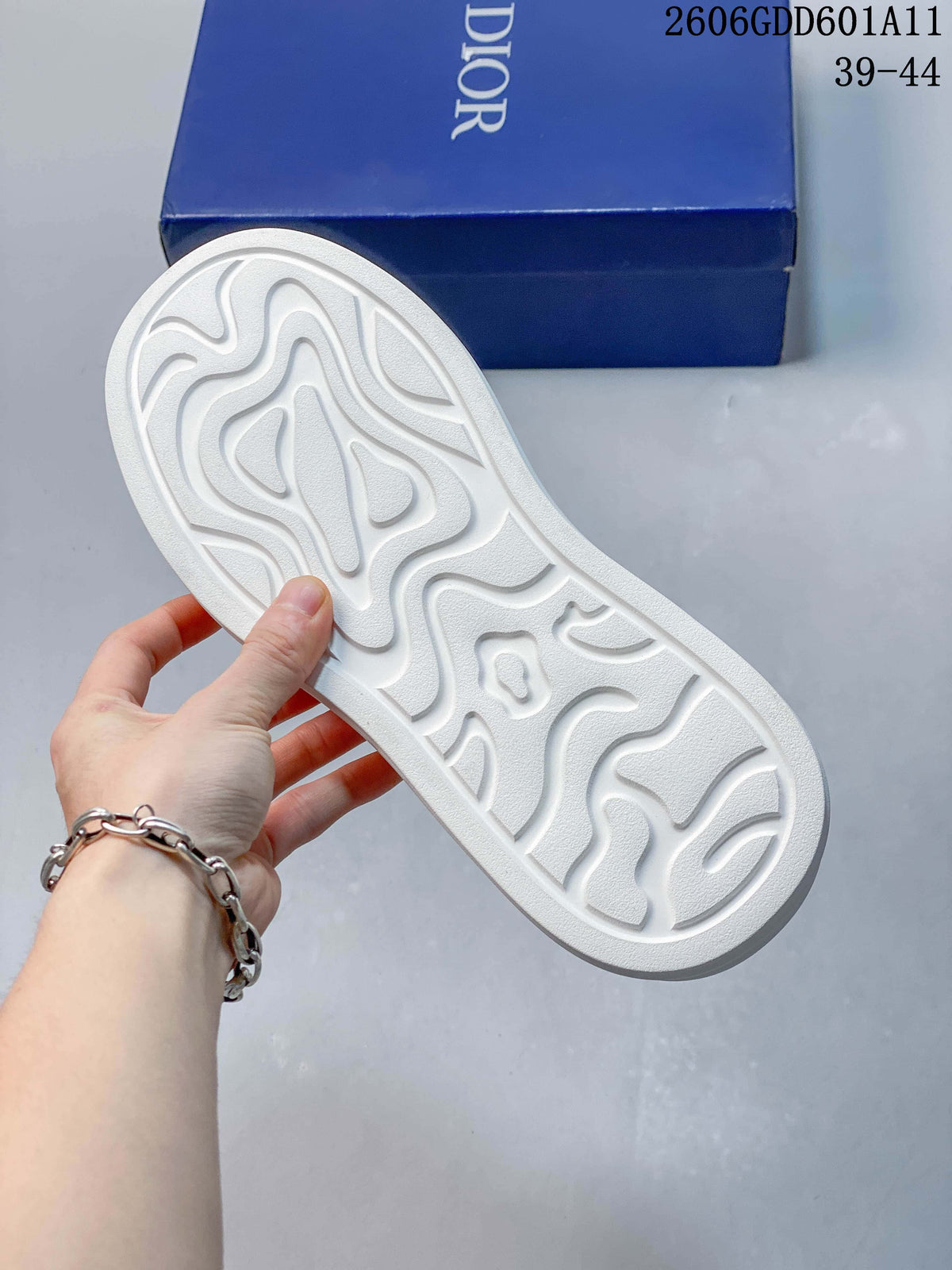 Underside of the sneaker showing a sculpted white outsole tread.