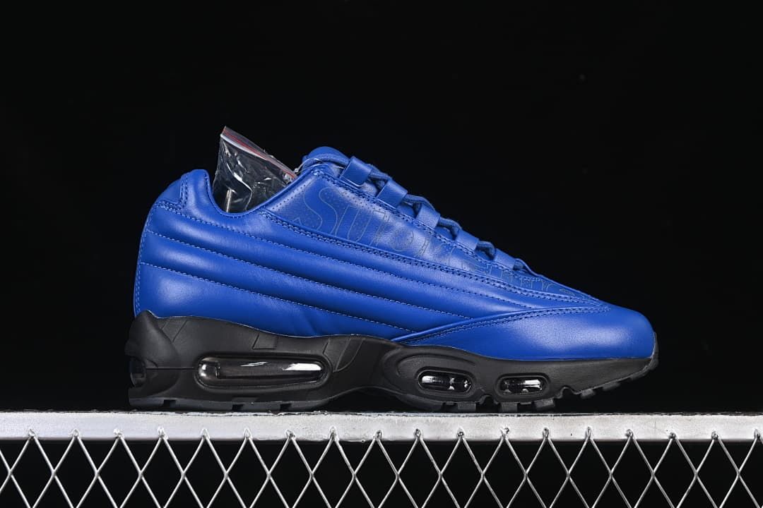 Side profile showing the blue upper and black sole with visible Air units.