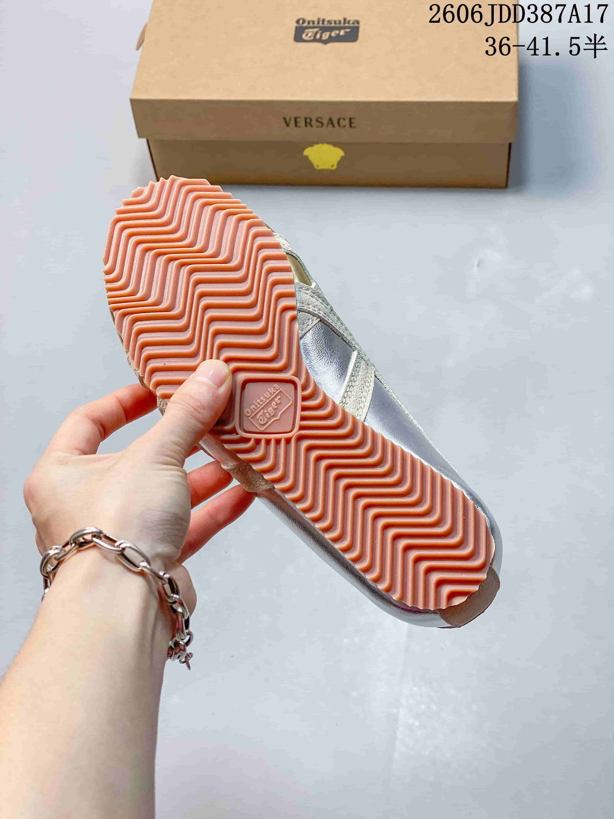 Close view of the sneaker's ridged gum-colored outsole