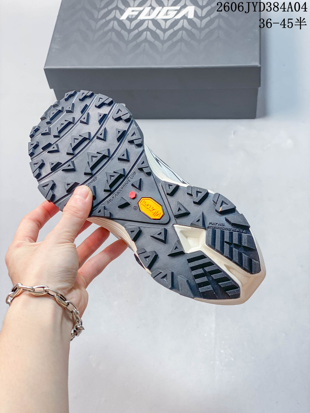 Close-up of the lugged outsole with a Vibram Megagrip mark