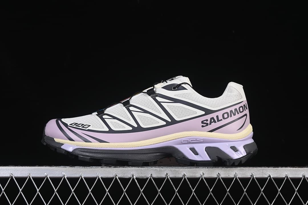 Side view of a white and lilac Salomon XT-6 sneaker