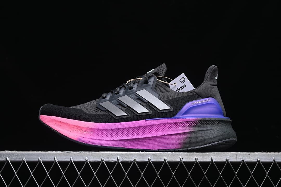 Side view of the shoe highlighting the pink midsole and blue-purple heel detail
