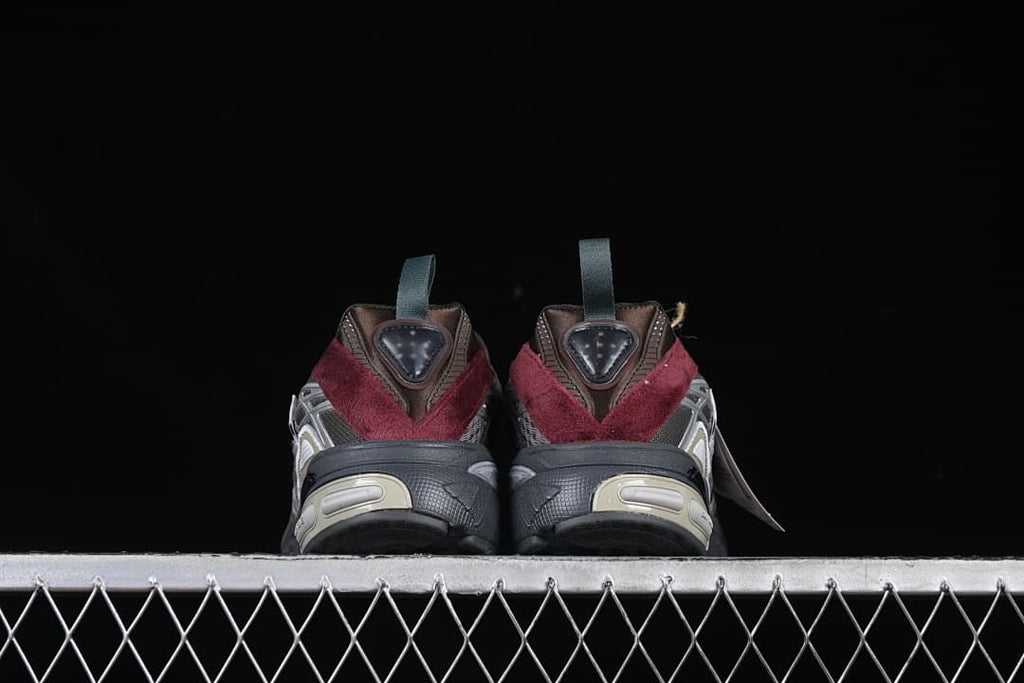 Rear view of the pair showing burgundy heel panels and sculpted soles.