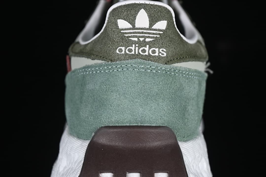 Rear view showing the adidas trefoil logo and layered green heel panels