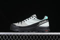 Side view of a grey, black, and turquoise Salomon X-ALP outdoor shoe.