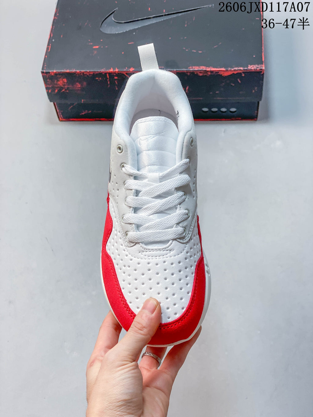 Top view of the white and red Nike Air Max 1 sneaker with laces