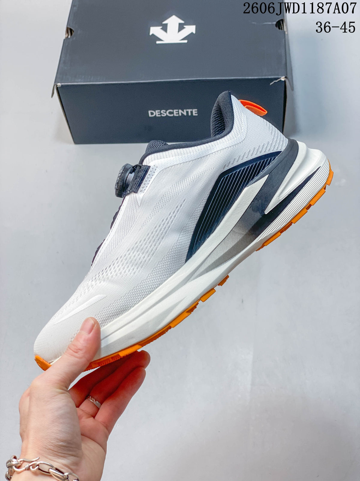 Side profile of the white trail-running shoe with navy detailing and orange outsole