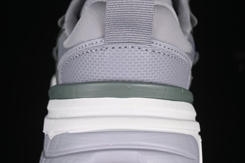 Rear close-up of the sneaker showing the heel pull tab and layered sole