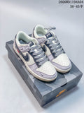 Pair of off-white, grey and navy low-top sneakers with patterned laces on a camouflage-patterned box