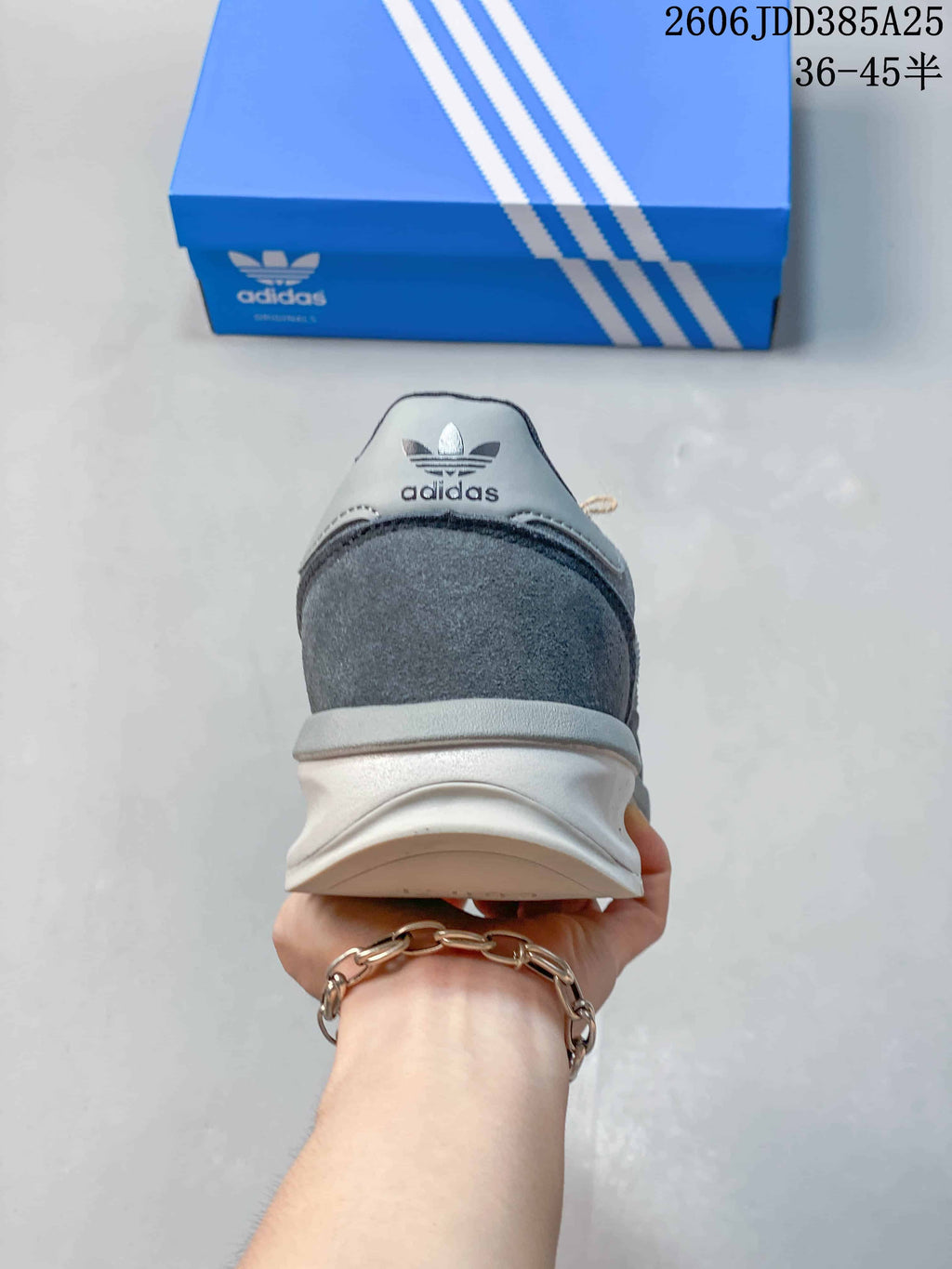 Rear view showing the heel and outsole of the grey adidas SL 72 sneaker