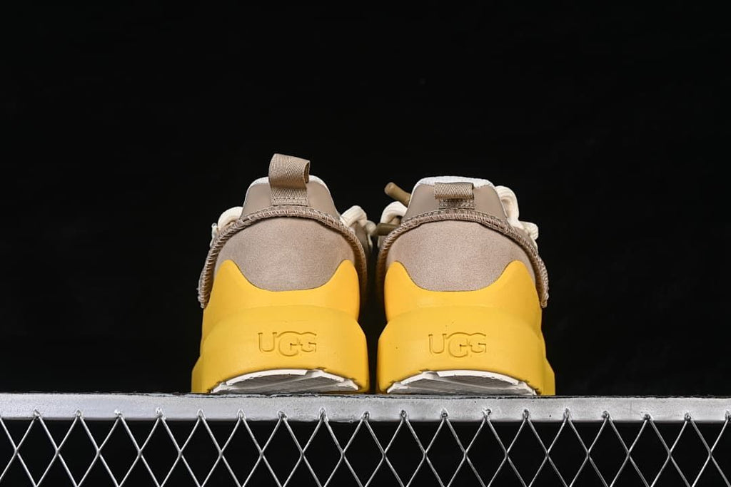 Rear view of the pair with yellow heels and UGG branding
