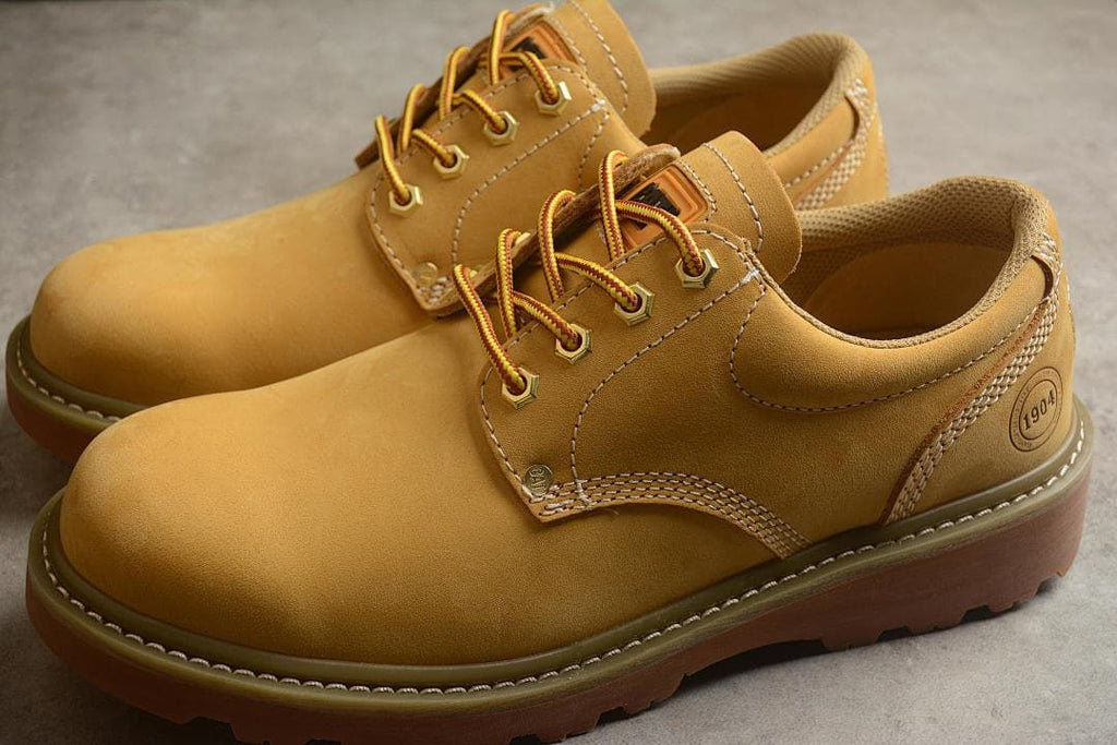 Pair of Boston yellow low-top lace-up shoes shown from above at an angle