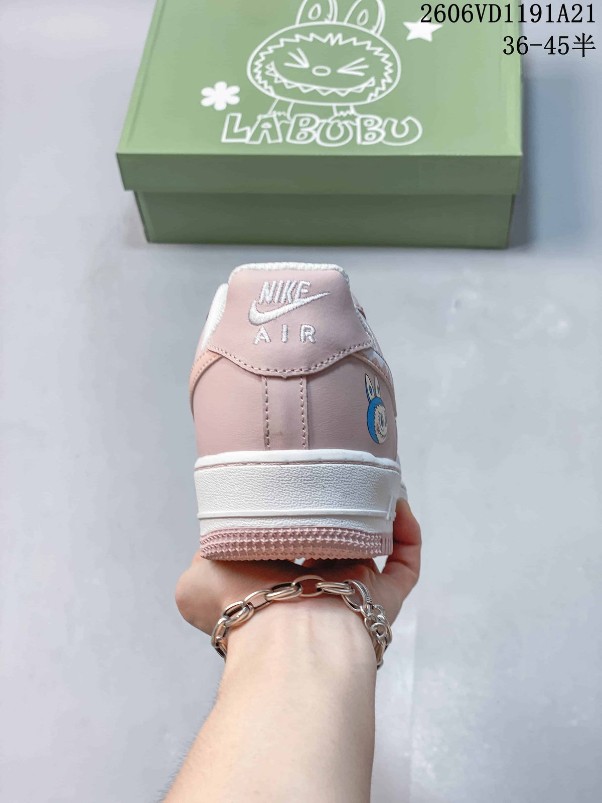 Rear view of the pink and white sneaker with a character graphic