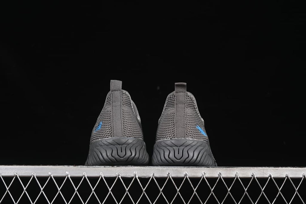 Rear view of the pair showing heel tabs and outsole grooves