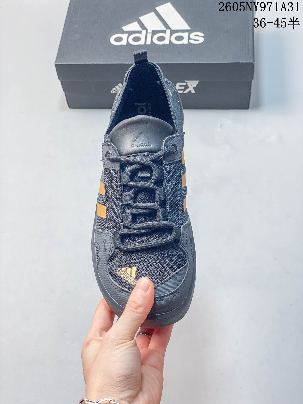 Top view showing the laces and mesh-like upper of a dark gray shoe