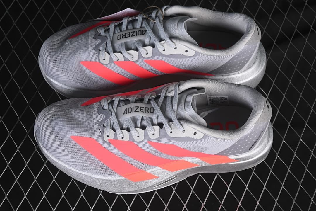 Pair of gray and coral Adizero Evo SL running shoes viewed from above
