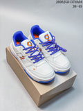 Pair of white On THE Roger Clubhouse sneakers with blue laces and orange accents, shown on a shoebox