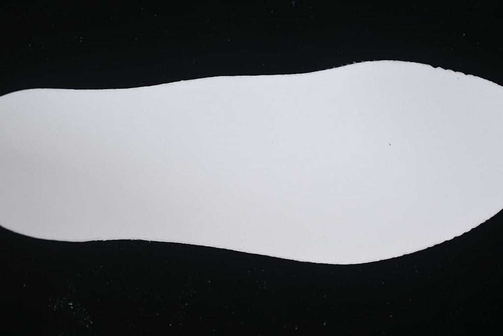 White shoe-shaped insert shown against a black background