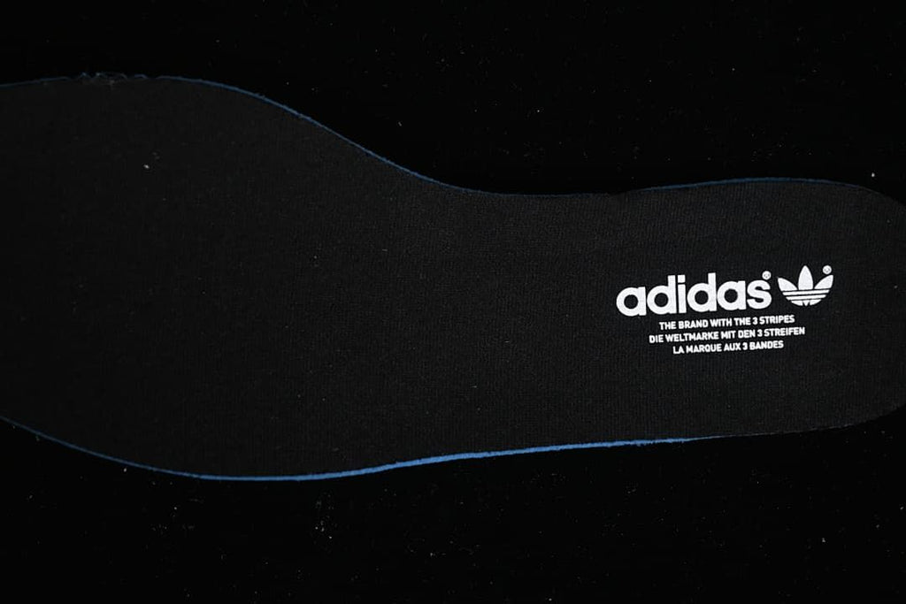 Black adidas insole with trefoil branding