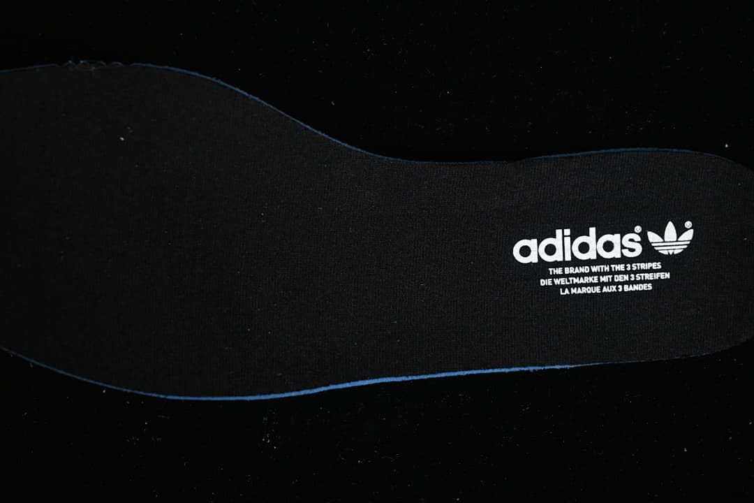 Black adidas insole with trefoil branding