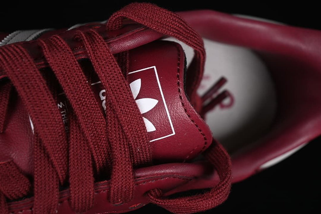 Close-up of the tongue branding and burgundy laces