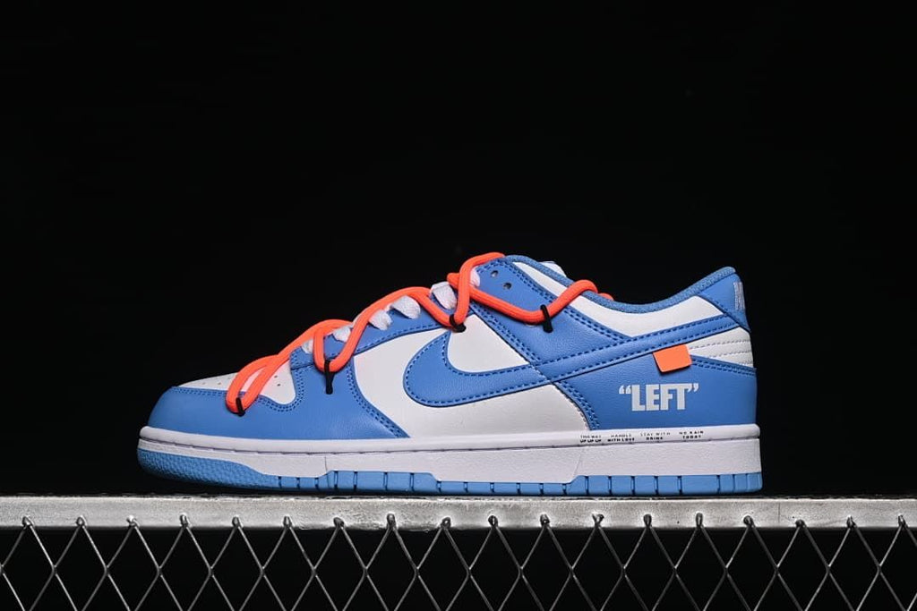 Side view of the sneaker with “LEFT” lettering and orange-red overlay laces.