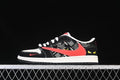 Side view of black, white, and red low-top Air Jordan 1 sneakers with patterned panels and yellow heel graphics.