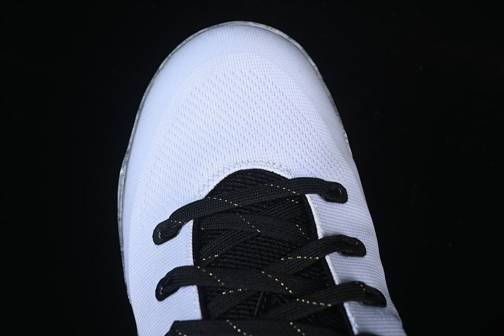 Top view of white toe and black lacing
