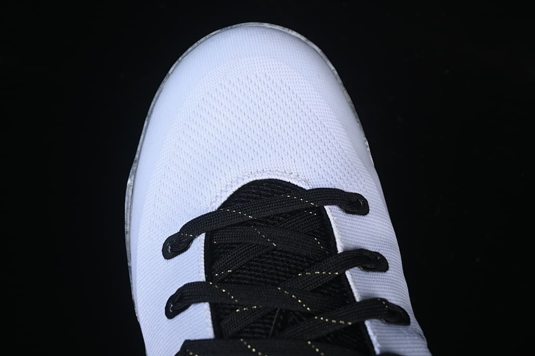 Top view of white toe and black lacing