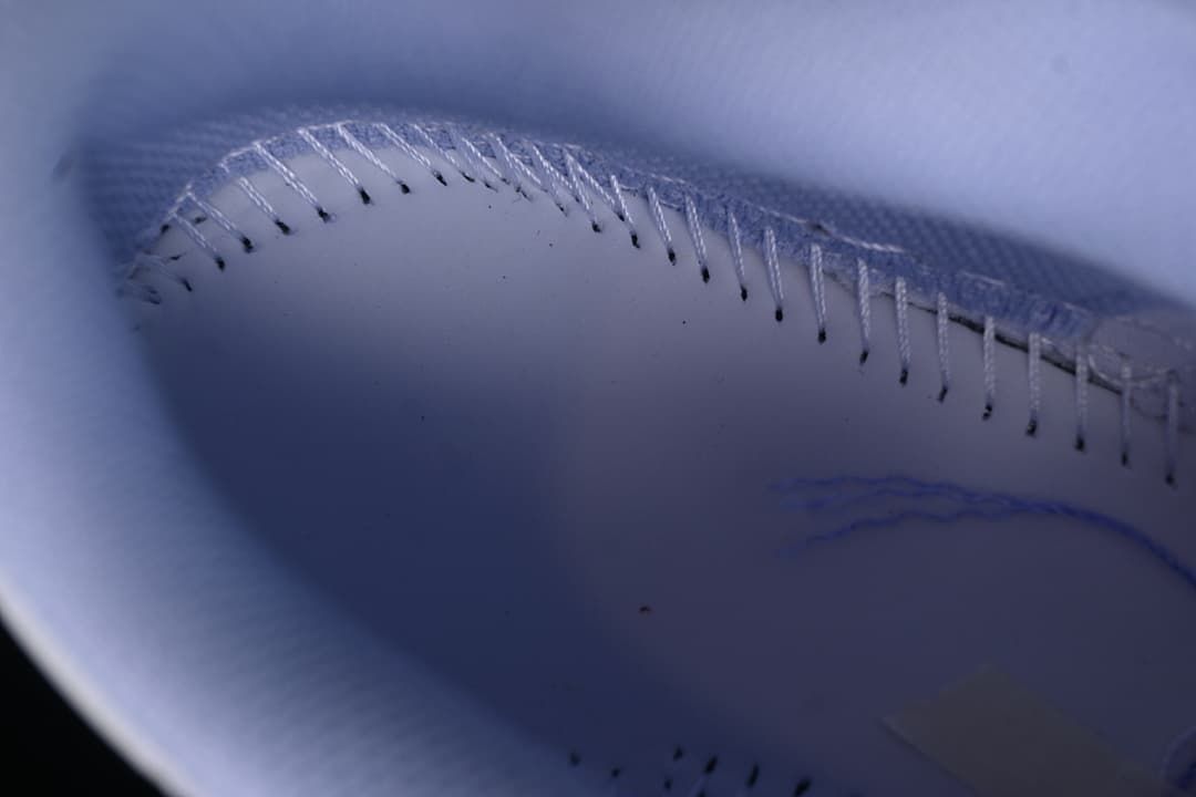 Close-up of stitching inside the lavender sneaker