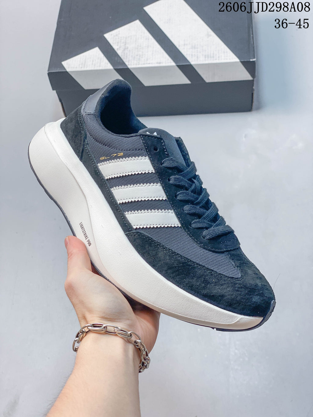 Dark navy adidas SL 72 Pro sneaker with white stripes and a chunky white sole