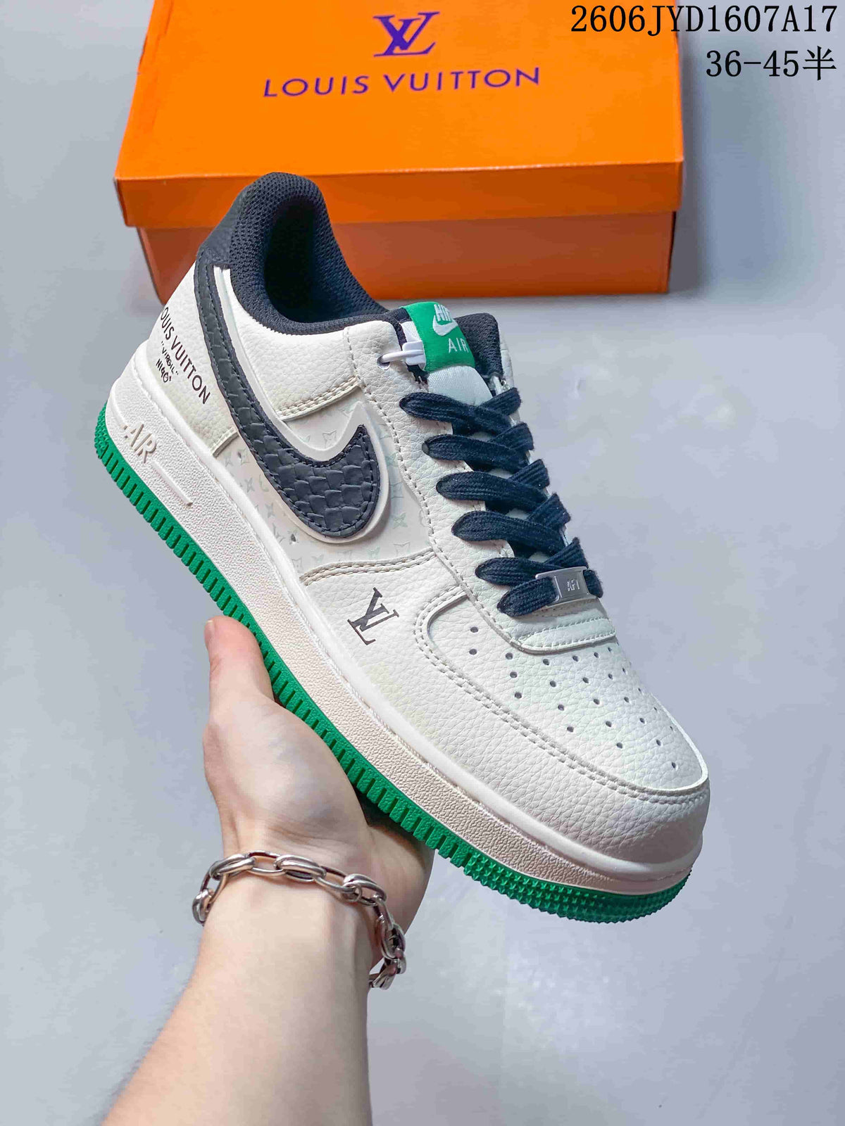 Angled view of the off-white sneaker with dark accents and green outsole
