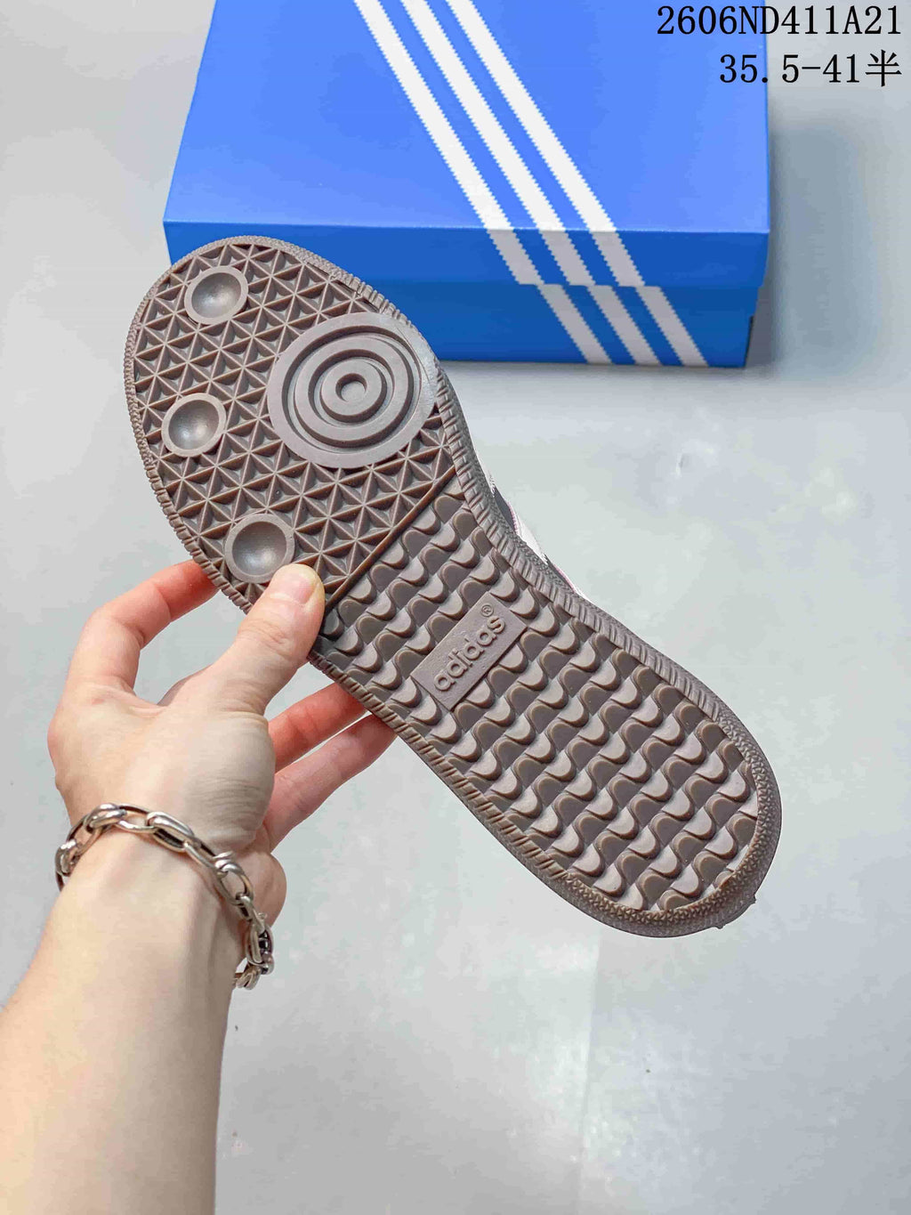 Close-up of the sneaker outsole showing its textured tread pattern.